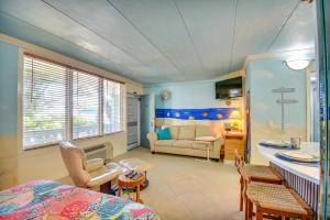 a room with a bed and a living room at Colorful Virginia Beach Studio - Steps to Beach! in Virginia Beach +18 photos