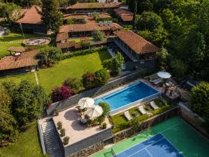 an aerial view of a house with a swimming pool at Orgánico Hotel Boutique VALLE DE BRAVO in Valle de Bravo