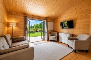 a living room with a couch and two chairs and a tv at 2 Bed in Nafferton oc-b31956 in Nafferton