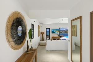 a living room with a mirror and a couch at Résidence AMARILLO Vue mer exceptionnelle face à Saint-Barthélémy in Cul de Sac