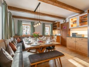 a kitchen and dining room with a table and chairs at Dorf30 in Going am Wilden Kaiser