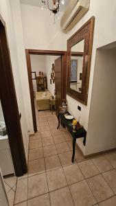 a living room with a mirror and a tiled floor at B&B La Torretta dei Ricordi in Formigine +17 photos
