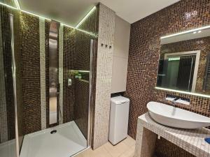 a bathroom with a shower and a toilet and a sink at Vision Luxury Apartment Rynek in Wrocław +26 photos
