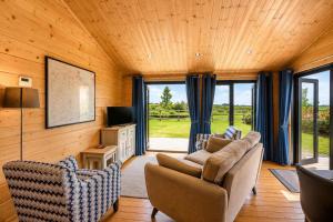a living room with a couch and chairs and a television at 2 Bed in Nafferton oc-o31954 in Nafferton