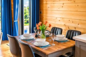a wooden table with a vase of flowers on it at 2 Bed in Nafferton oc-o31954 in Nafferton +7 photos