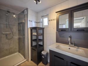 a bathroom with a sink and a shower and a tub at t Kaatsheuveltje 1 in Kaatsheuvel +21 photos