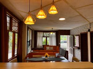 a living room with a table and a couch at Relax Home in Puyo