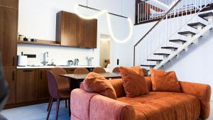 a living room with a couch and a table at Нова Дача in Kozintsy