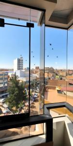 a view of a city from a window in a building at APART SExTA ESTACIÓN in Juliaca +2 photos
