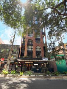a building on the corner of a street at Urbit Garden Hotel in Medellín +31 photos
