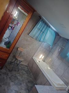 an overhead view of a bathroom with a shower and a tub at Casa HerShei in Orange Walk +18 photos