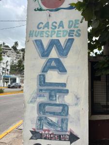 a sign that says casa de investigaciones at Casa Walton in Acapulco