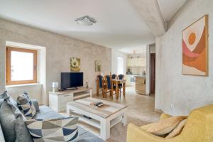 a living room with a couch and a table at Historic Old Town Kotor in Kotor