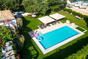 an overhead view of a swimming pool in a yard at Barbati Beachfront - Pool Villa in Barbati