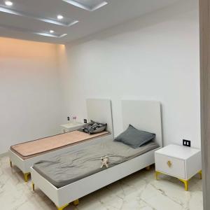 a bedroom with a bed and two night stands at Villa Jenna in Kelibia