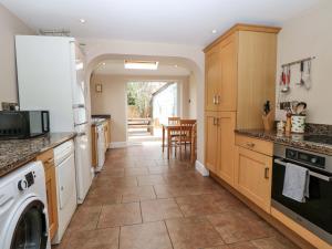 a kitchen with a washer and dryer at Tilly's Retreat in Hunstanton