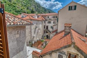 a view of a group of buildings and roofs at Historic Old Town Kotor in Kotor