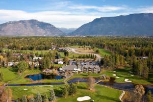 an aerial view of a resort with mountains in the background at Meadow Lake Resort & Condos in Columbia Falls