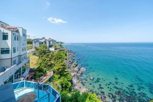 an aerial view of the ocean from a building at Samcheok Pureun Bada Pension in Samcheok