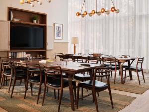 a conference room with a large table and chairs at The Hoxton, Poblenou in Barcelona