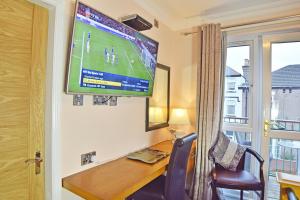 A television and/or entertainment center at Dovedale Hotel and Restaurant 