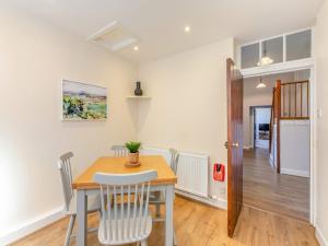 a kitchen and dining room with a table and chairs at The Old Bakery - Uk48319 in Berwick-Upon-Tweed