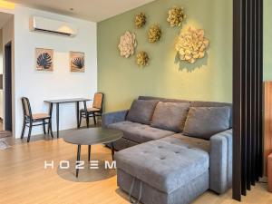 a living room with a couch and a table at SB1B4P Hozem SA B46 Roxy Sematan in Sematan