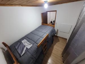 a bedroom with a large bed in a room at Hospedaje J & L 2 in Uspallata