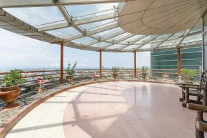 a view from the top of a building with a glass roof at Crown Regency Hotel & Towers in Cebu City