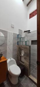a bathroom with a toilet and a sink at Portón del Río Jericó in Jericó +104 photos
