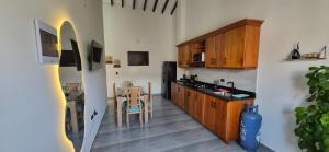 a kitchen with a table and a dining room at Portón del Río Jericó in Jericó