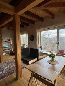 a living room with a couch and a table at Простір Джерело Гармонії in Kaniv