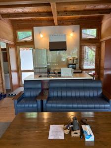 a kitchen with a blue bench in a room at YAMAYA BASE 2 in Miyoshi