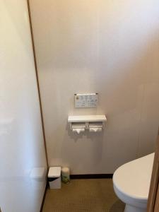a bathroom with a toilet in a room at YAMAYA BASE 2 in Miyoshi