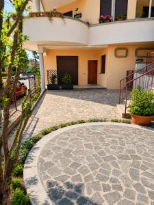 a patio in front of a house at BluTerra home in Porto San Giorgio