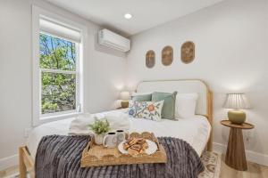 a bedroom with a bed with a tray of food on it at Timberline Flats in Traverse City