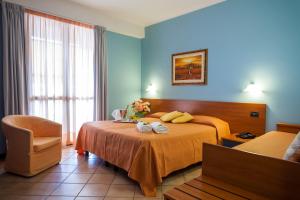 Postel nebo postele na pokoji v ubytování Hotel Bacco + 30 fotografií