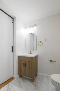 a bathroom with a sink and a mirror at Rustic Private Studio Near Downtown Worcester in Worcester