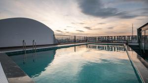 a swimming pool on the roof of a building at MT Collection Legacy Hotel Ninh Binh - Near Hoa Lu Ancient Town with Rooftop Pool in Ninh Binh