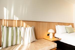 a bedroom with a bed and a table with a lamp at HaKu in Brunswick Heads +41 photos
