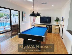 a pool table in the middle of a living room at Edgewater Whole Holiday Resort in Perth