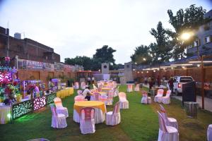 a group of tables and chairs on the grass at Lagna Mahal in Birnon