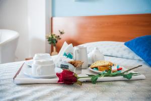 Postel nebo postele na pokoji v ubytování Hotel Bacco