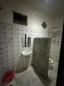 a bathroom with a sink and a toilet at Sari Buana Bed & Breakfast in Kuta +20 photos