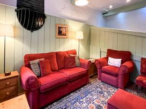 a living room with a couch and two chairs at Saddle Room - Uk51017 in Louth