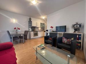 a living room with a couch and a table at My Adventure Appartements by Schladmingurlaub - 150 Meter zur Gondel in Schladming