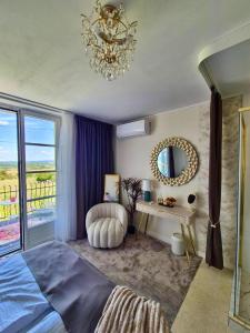 a bedroom with a bed and a mirror and a desk at Gyémánt Vendégház in Doba +18 photos