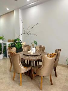 a dining room with a table and chairs at Phố Homestay Phan Thiết in Phan Thiet