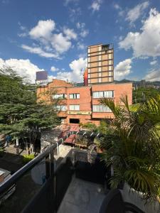 a view of a building from a balcony at Hotel Lleras # 1 in Medellín