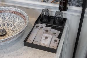 a box of bottles of soap sitting next to a sink at Can Gio Park Hotel in Cần Giờ +56 photos